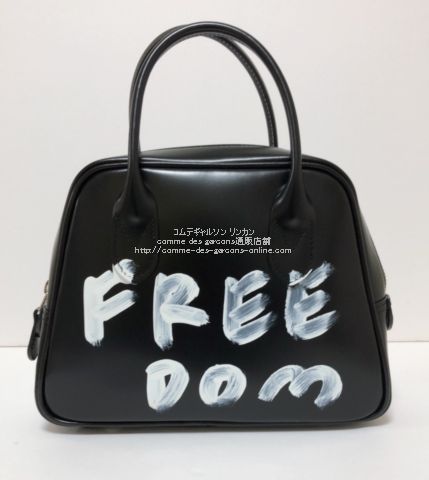 コムデギャルソン 吉田カバン 台形「FREE Dom」メッセージプリント